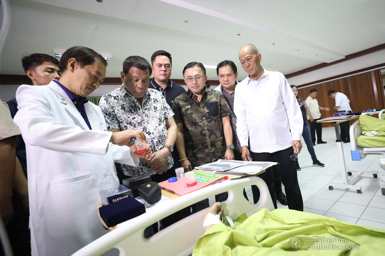 President Rodrigo Roa Duterte examines the injury of one of the wounded law enforcers he visited at the Divine Word Hospital in Tacloban City on November 15, 2019. ACE MORANDANTE/PRESIDENTIAL PHOTO
